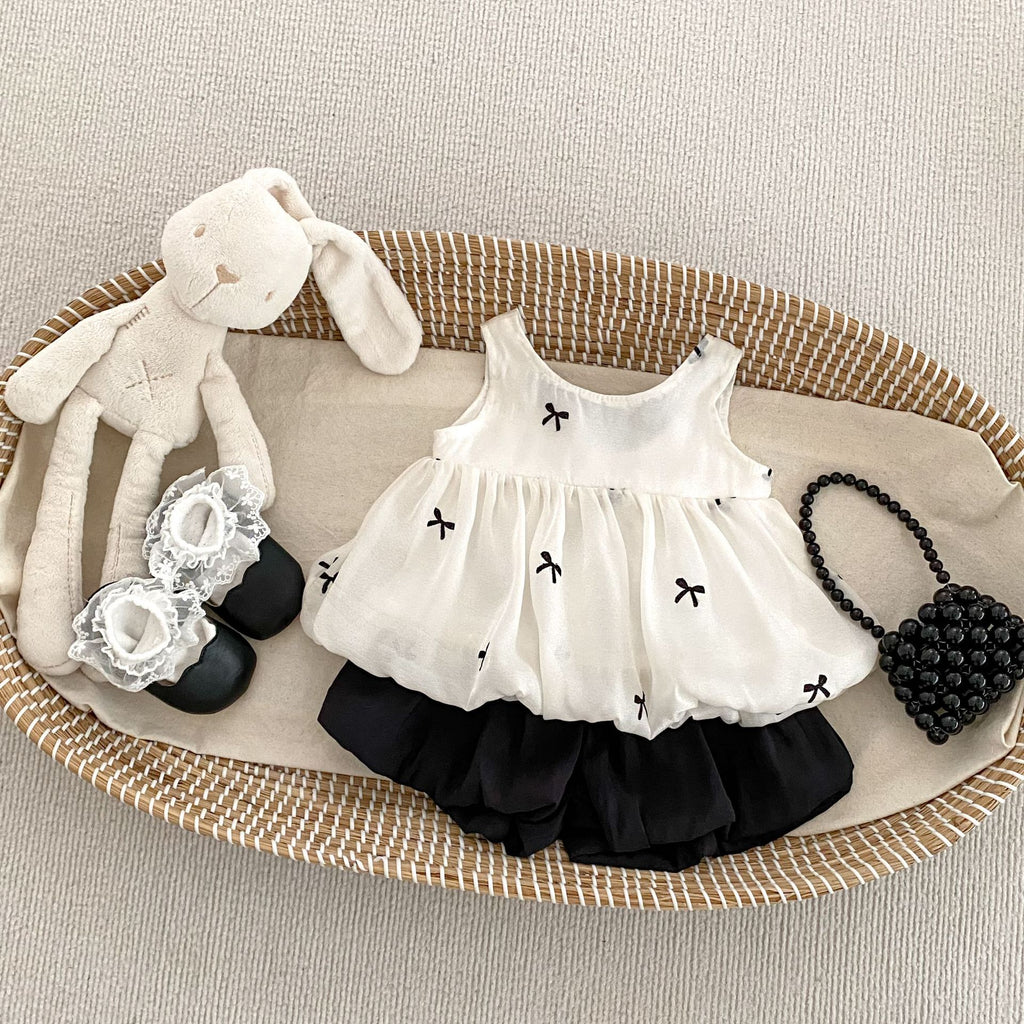 Charming Girls' Summer Two-Piece Set with Fairy-Like Bow Top and Versatile Pom-Pom Shorts